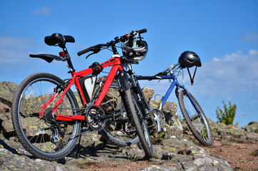 two mountain bikes standing in countryside