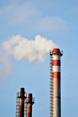 Smoke and steam comes out from factory chimney