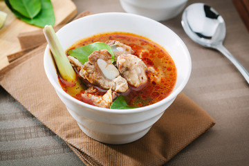 Hot and spicy soup with pork ribs,shallow Depth of Field,Focus on  pork ribs.