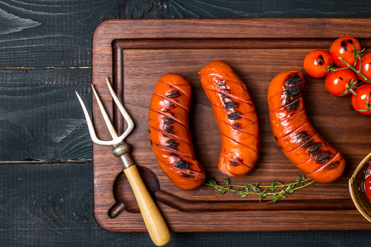 Grilled sausage with tomato and ketchup