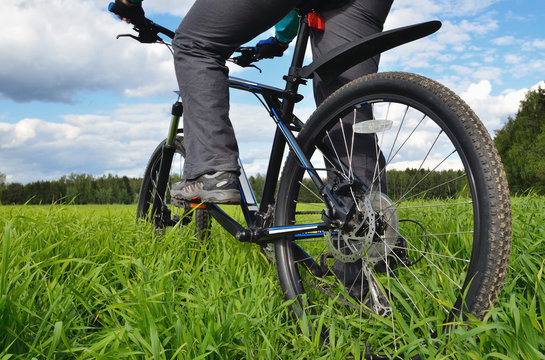 bicyclist riding a mountain bike in countryside