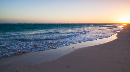 Colorful sunrise on Atlantic ocean coast, beach
