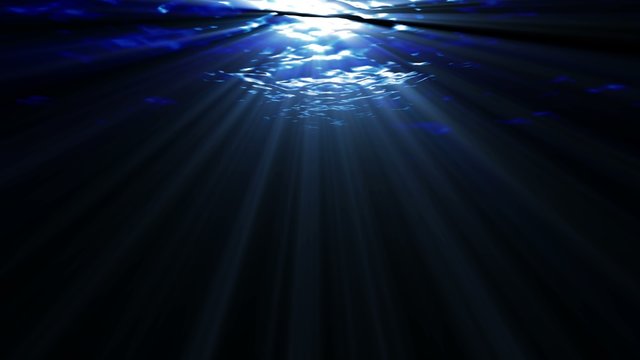 Underwater ocean waves, with light rays.