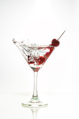 Cocktail with splash and on white