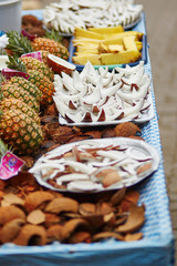 Selection of fresh coconut snacks on a traditional Moroccan market