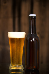 Cold Craft Beer of two bottles and a glass.