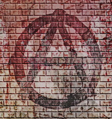 grunge anarchy symbol on old red brick wall background