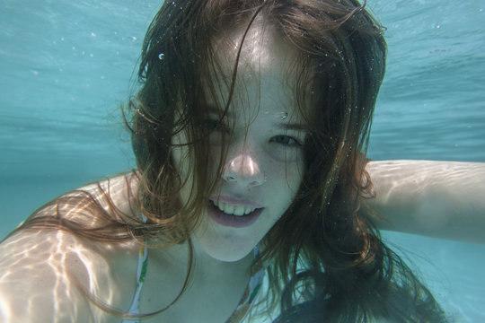 Girl Underwater Swimming pool summer fun happiness portrait