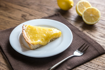 Slice of lemon tart on the plate