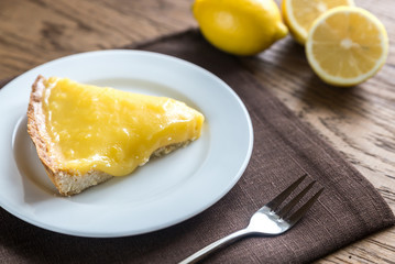 Slice of lemon tart on the plate