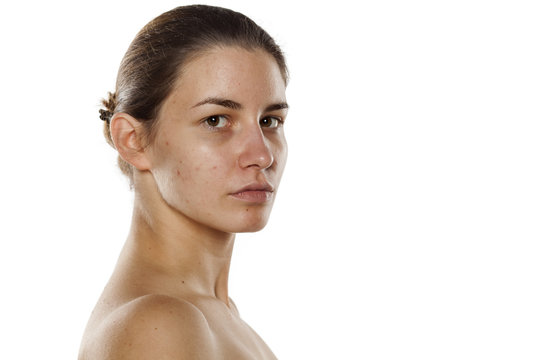 young beautiful woman without makeup on a white background
