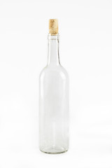 Empty glass bottle with cork isolated on white background

