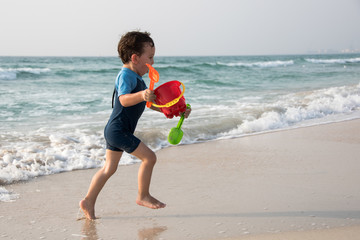Boy is Enjoying Playing on the Beach
