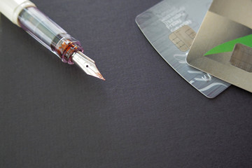 credit card and pen , selective focus