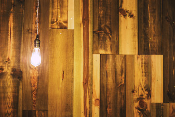 Vintage lamp on wooden wall