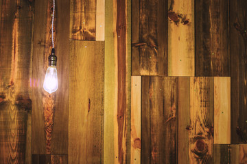Vintage lamp on wooden wall
