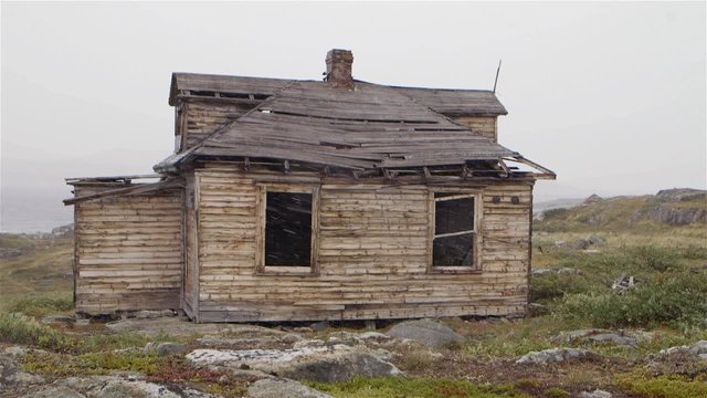 Abandoned building in Hebron, Newfoundland and Labrador on a snowy day. Slow Motion