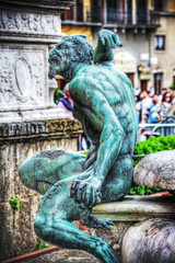 Fototapeta na wymiar satyr bronze statue in Neptune fountain in Florence