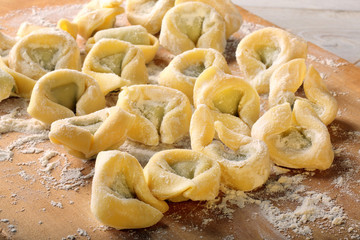 Fresh homemade noodles with meat on board