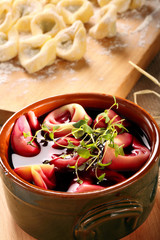 Homemade borscht with dumplings and herbs