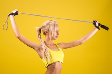 Portrait of young and healthy blonde with skipping rope