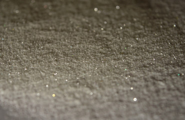 Blurred background with glitter sparkles like a snow in the night lights