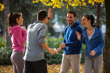 Group of young people relaxing at the park.