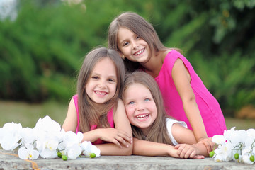 Portrait of three girlfriends on the nature