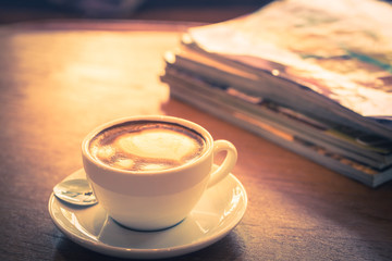 Coffee cup with book