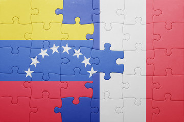 Fototapeta premium puzzle with the national flag of venezuela and france