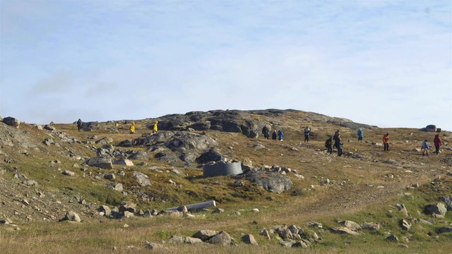 Time-lapse of expeditioners exploring a hillside near an abandoned town in Northern Quebec.