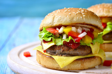 Homemade burger with meat cutlet,cheese and sweet pepper.