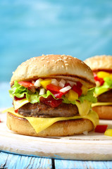 Homemade burger with meat cutlet,cheese and sweet pepper.
