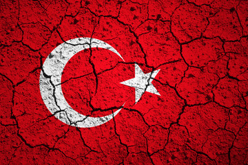 Aged old textured Turkey flag. Grunge cracked soil effect used.