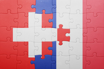 puzzle with the national flag of switzerland and france