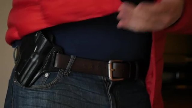 Gun Drawn From Concealed Holster Under Coat, Slow Motion