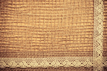 Lace frame on burlap cloth background