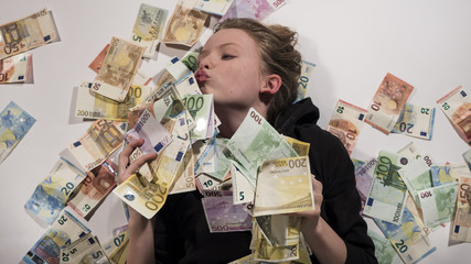 True love, girl kissing Euro bills