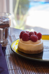 Closeup of an individual raspberry cheesecake