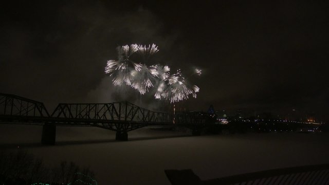Slow motion fireworks over Alexandria Bridge crossing the Ottawa River during Winterlude.