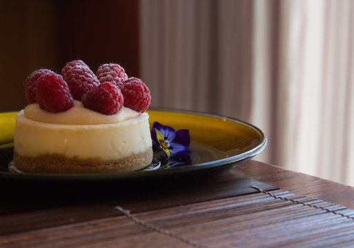 Closeup of an individual raspberry cheesecake