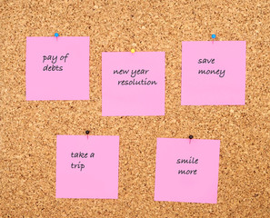 New year resolution written on pink sticker notes