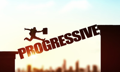 Silhouette of businessman over sunrise