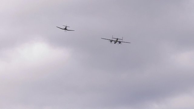 A North American B-25 Mitchell Plane and a Goodyear FG-1D Corsair fly in Ottawa, Ontario.