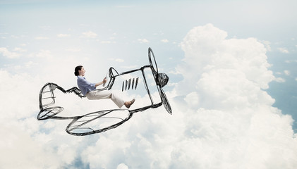 Woman in drawn airplane