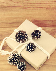 christmas present with pine cone with vintage filter effect retr