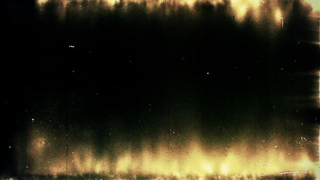 Video Background 0410: Grunge and scratches on old film leader (Video Loop).