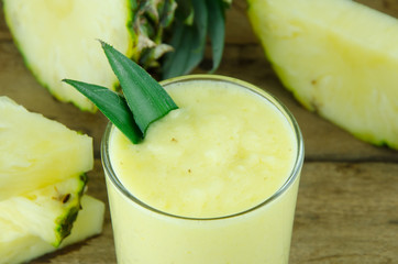 pineapple juice and slice on wooden