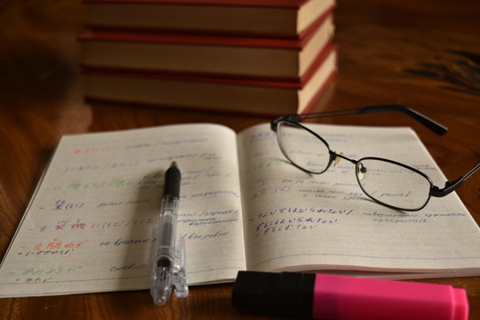Notebook with pen and glasses, develop memory
