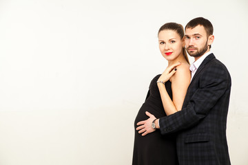 Young happy cheerful pregnant woman with husband together